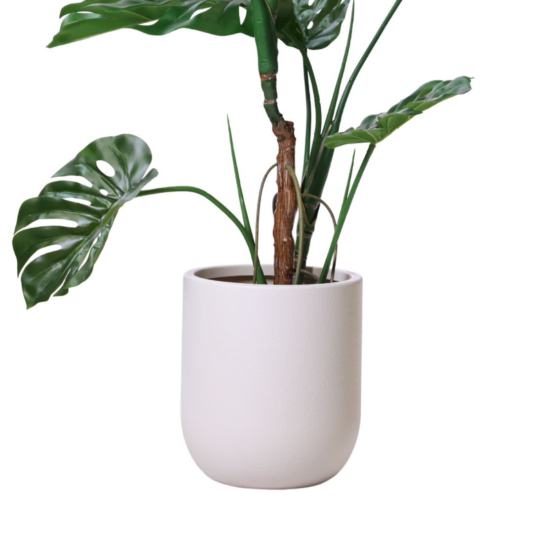 Slik velger du riktig potte for å fremheve store kunstige planter